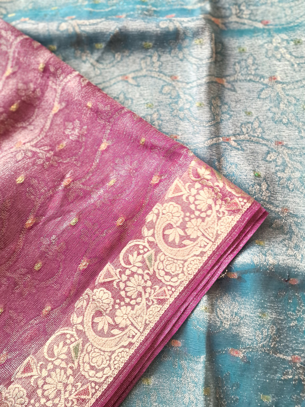 tissue / banarasi silk-blend saree with a metallic zari weave.